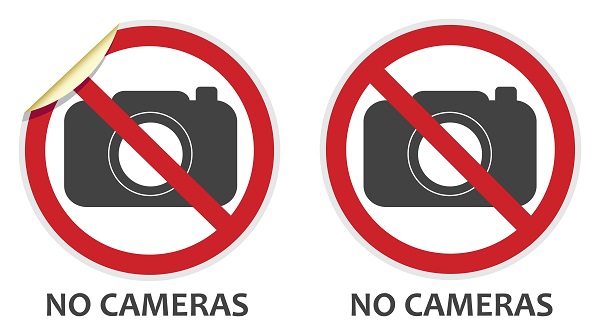 No cameras or photography signs in two vector styles depicting banned activities